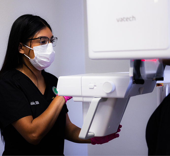 Austin dental team member taking a scan of a patients teeth and jaws