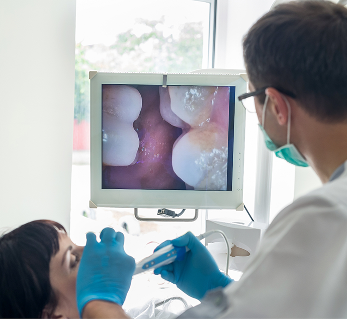 Dentist capturing close up photos of a patients teeth