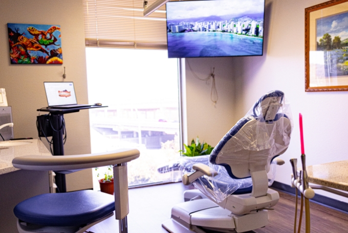 Dental chair with sunlight streaming in through the window in front of it