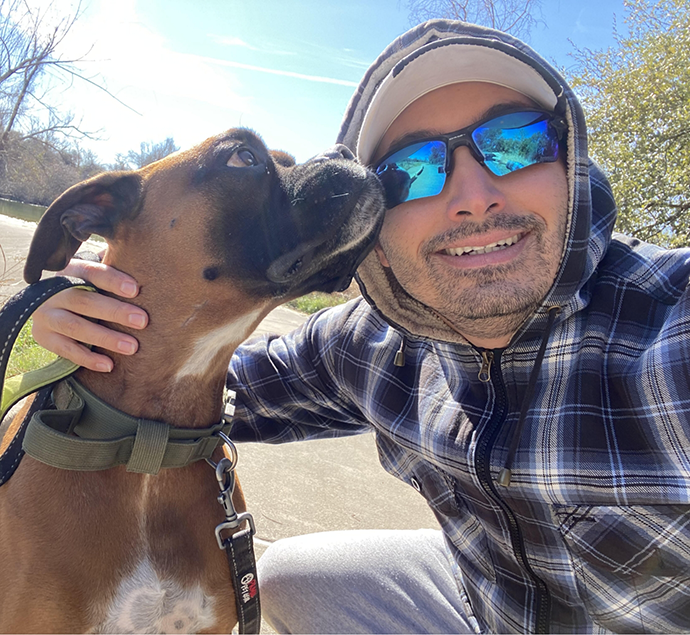 Selfie of Doctor Pevzner outside with his dog