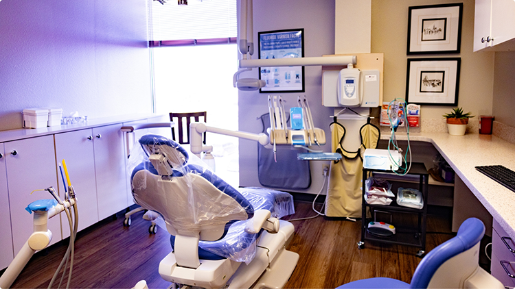 Dental treatment room with sunlight streaming in through the window