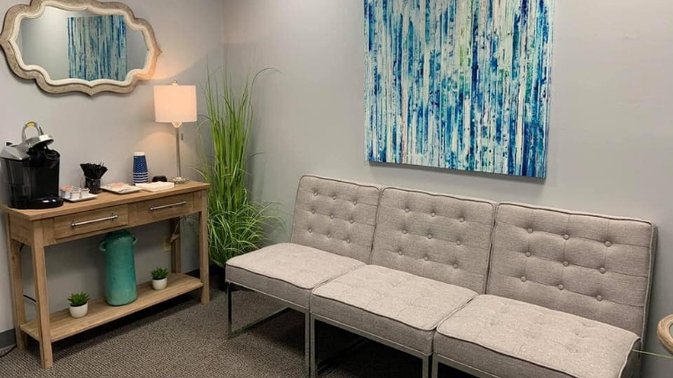 Soft gray couch in waiting area