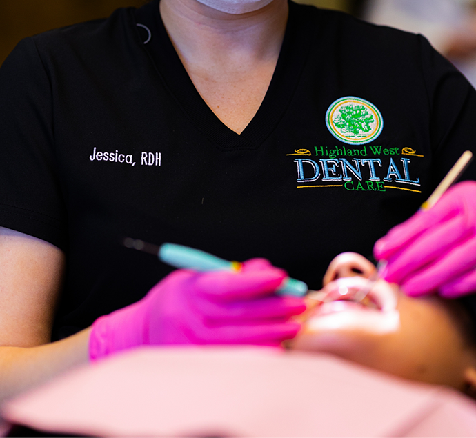 Dental hygienist giving a patient a preventive dentistry cleaning