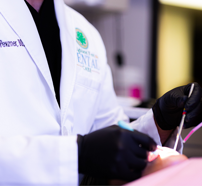 Close up of Doctor Pevzner treating a dental patient